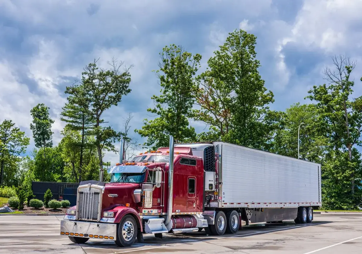 Couple with professional movers on moving day loading truck