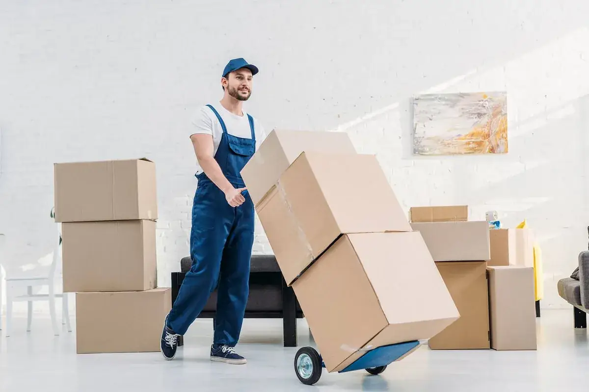 Cross country movers carrying furniture in Dallas, TX