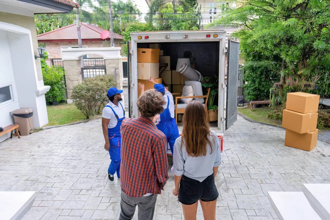 Professional mover stacking boxes inside truck for cross-country move
