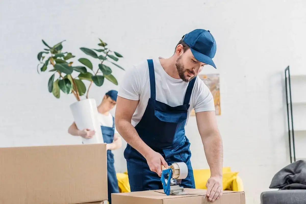 Professional movers loading a long-distance moving truck