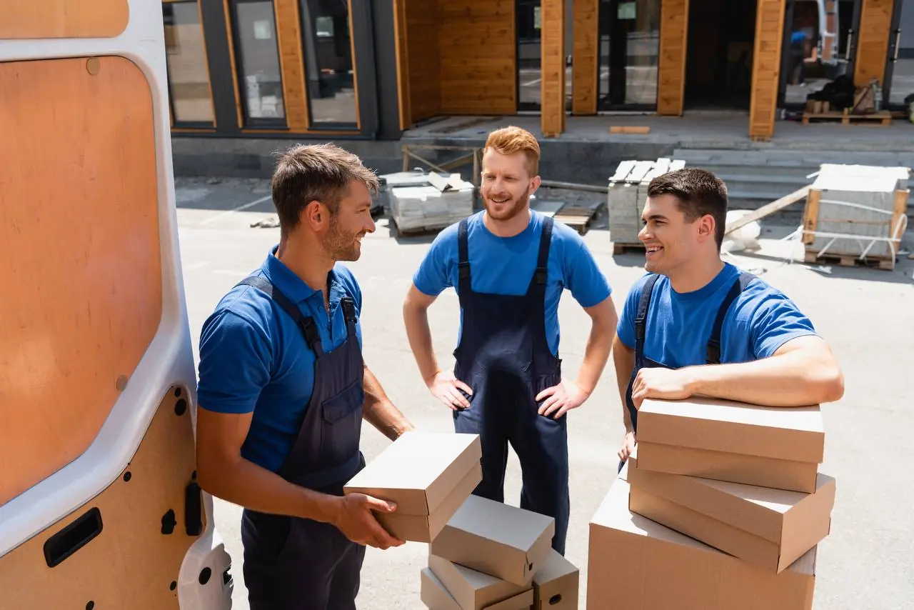 Woman labeling boxes before long distance move